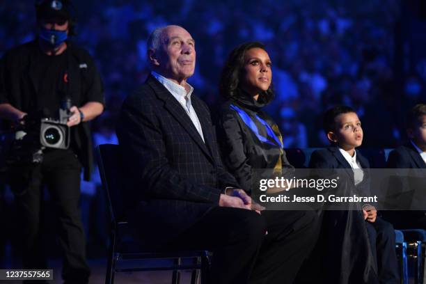 Coach and mentor of Dirk Nowitzki, Holger Geschwindner and Jessica Olsson look on during a ceremony honoring Dirks career and retiring his jersey on...