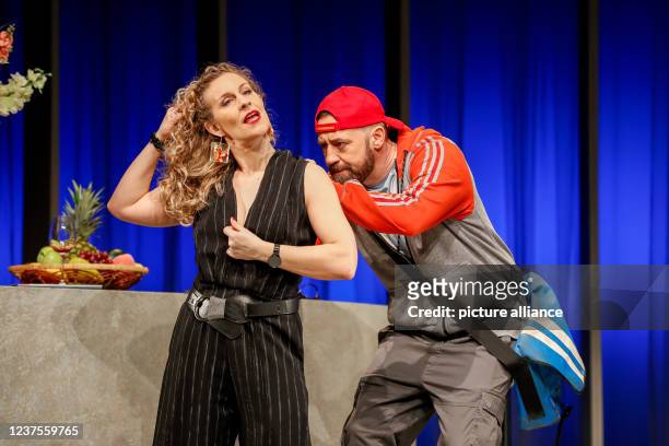 January 2022, Berlin: Alessija Lause and citizen Lars Dietrich stand on stage during the photo rehearsal of the play "Rent a Friend" at the...