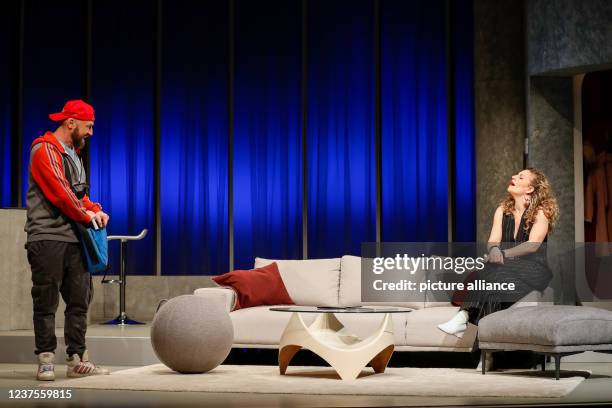 January 2022, Berlin: Alessija Lause and citizen Lars Dietrich stand on stage during the photo rehearsal of the play "Rent a Friend" at the...