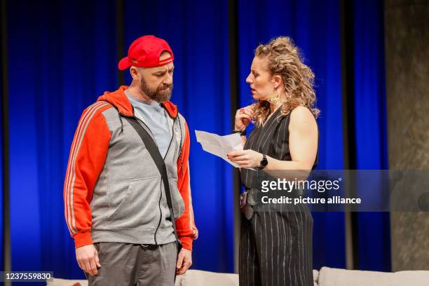 January 2022, Berlin: Alessija Lause and citizen Lars Dietrich stand on stage during the photo rehearsal of the play "Rent a Friend" at the...