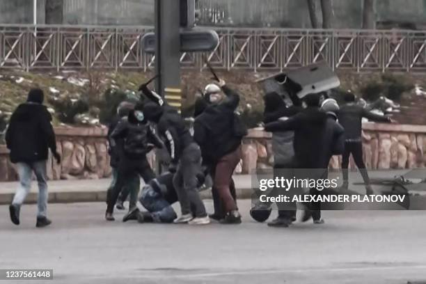 Frame grab taken on January 6, 2022 from an AFPTV video made on January 5 shows protesters clashing with Kazakstan's security forces during a...