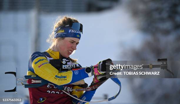 Swedens Elvira Oeberg adjusts her rifle during a practice session at the IBU Biathlon World Cup in Oberhof on January 6 the day before the men's 10KM...