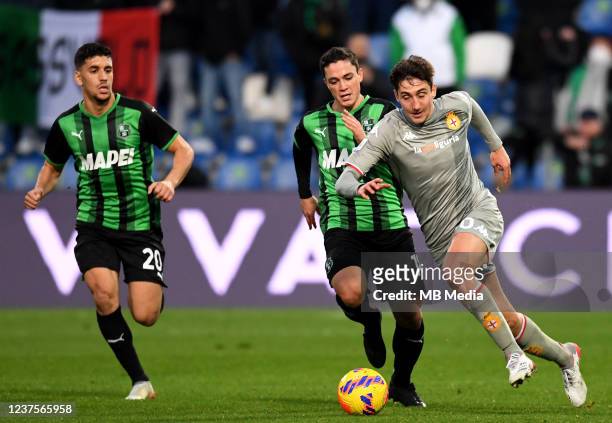 Andrea Cambiaso of Genoa CFC competes for the ball with Giacomo Raspadori of US Sassuolo ,during the Serie A match between US Sassuolo and Genoa CFC...