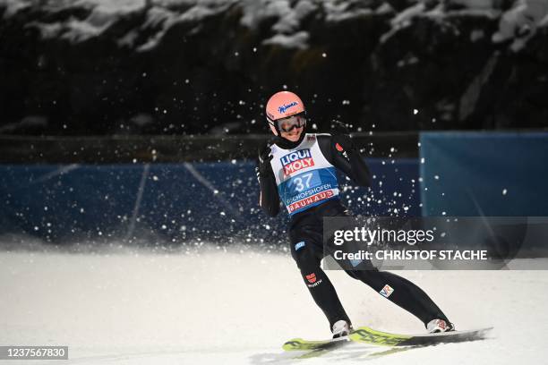 Germany's Karl Geiger reacts after his jump during the second and final round of the Four-Hills FIS Ski Jumping tournament in Bischofshofen, Austria,...