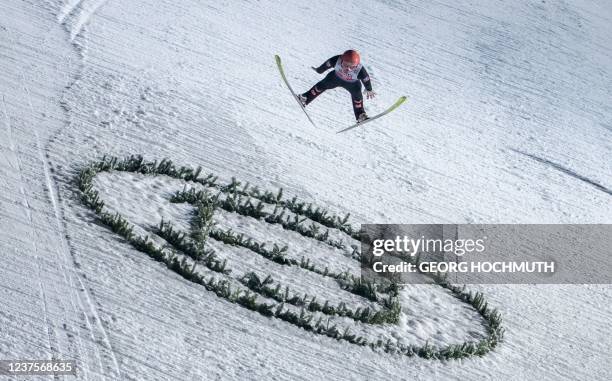 Austria's Daniel Huber soars through the air to win the second and final round of the Four-Hills FIS Ski Jumping tournament in Bischofshofen,...