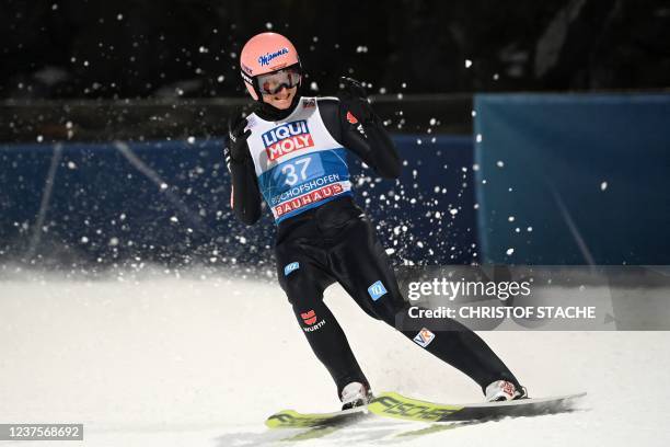 Germany's Karl Geiger reacts after his jump during the second and final round of the Four-Hills FIS Ski Jumping tournament in Bischofshofen, Austria,...