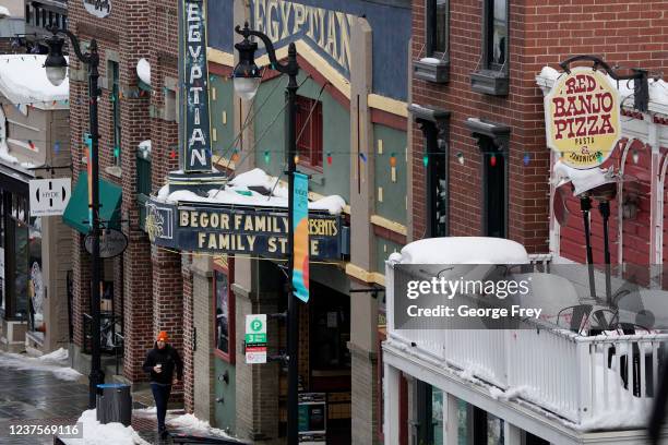 January 6: A person walks past the Egyptian Theater on Old Main Street where filmgoers would have gathered for the 2022 Sundance Film Festival on...