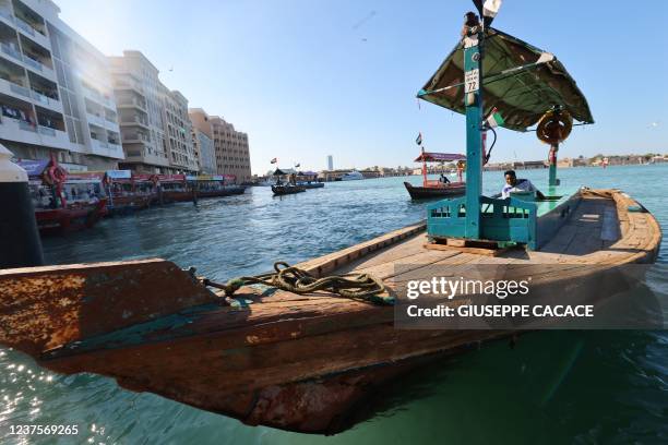 This picture taken on January 6, 2022 shows a traditional ferry boat, known as abra, used to cross the creek that separates Bur Dubai from Deira in...