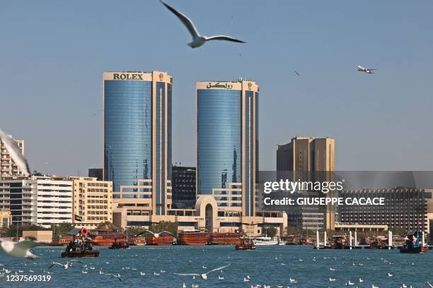 This picture taken on January 6, 2022 shows traditional ferry boats, known as abras, used to cross the creek that separates Bur Dubai from Deira in...