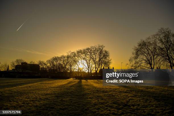 Frost covered landscape at sunrise in London with sub zero temperatures in the capital.