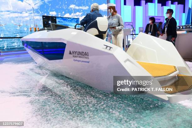 An attendee sits for a demonstration in a model of the Hyundai Heavy Industries Group's Avikus autonomous cruising leisure boat during the Consumer...