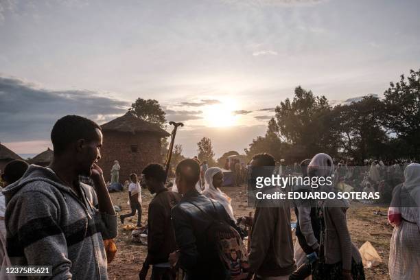Pilgrims walk in one of the pilgrims camp sites during the eve of the celebration of Genna, the Ethiopian Orthodox Christmas, in Lalibela, home to a...