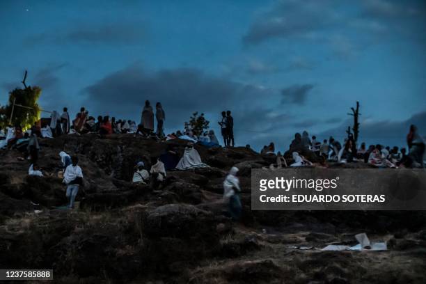Pilgrims walk and rest in one of the pilgrims camp sites during the eve of the celebration of Genna, the Ethiopian Orthodox Christmas, in Lalibela,...