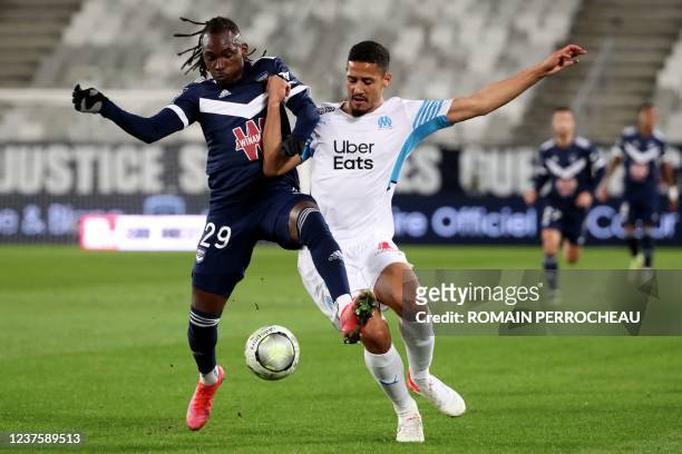 Marseille's French defender William Saliba fights for the ball with Bordeaux' Honduran forward Alberth Elis during the French L1 football match...