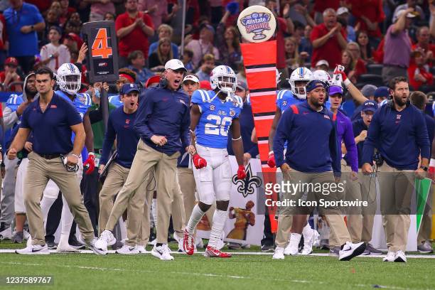 Ole Miss coaches and players celebrate a fourth down stop by the Ole Miss defense during the Allstate Sugar Bowl between the Ole Miss Rebels and the...