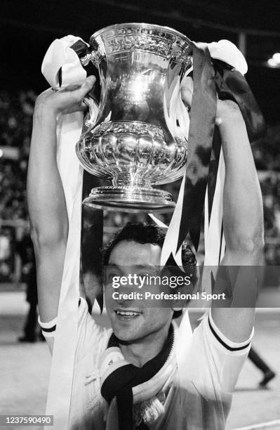 Osvaldo Ardiles of Tottenham Hotspur celebrates with the trophy after the FA Cup Final replay between Tottenham Hotspur and Manchester City at...