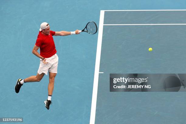 Denis Shapovalov of Canada plays a backhand against Roman Safiullin of Russia during their men's singles semi-final match on day 8 of the 2022 ATP...