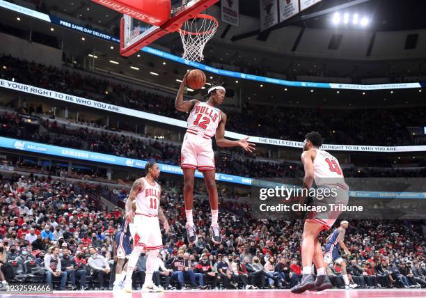 Chicago Bulls guard Ayo Dosunmu rises to grab a rebound in the fourth quarter against the Washington Wizards at United Center on Jan. 7 in Chicago.