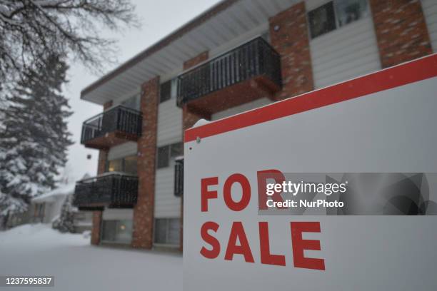 For Sale sign seen outside a house in the center of Edmonton. On Friday, January 7 in Edmonton, Alberta, Canada.