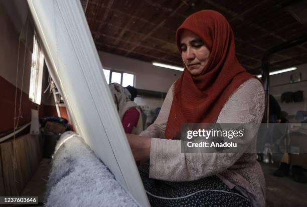 Women weave handmade carpets on handlooms at their houses while contributing the economy of the country as Demirci carpets being exported to more...