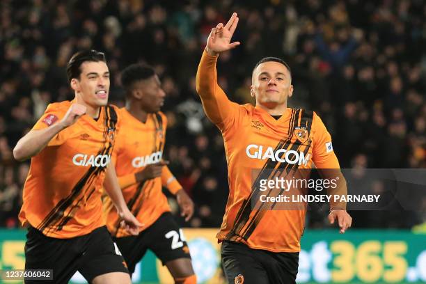 Hull City's English striker Tyler Smith celebrates after scoring the opening goal of the English FA Cup third round football match between Hull City...