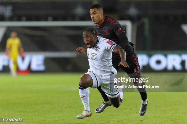 Michael Obafemi of Swansea City is fouled by Yan Valery of Southampton during the Emirates FA Cup Third Round match between Swansea City and...