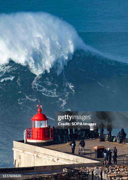 728 Surfers Take On Huge Waves At Nazare In Portugal Stock Photos, High-Res  Pictures, and Images - Getty Images
