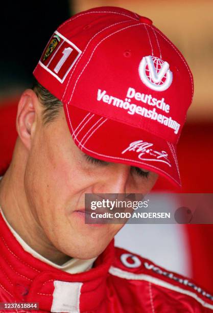 Picture of German Ferrari driver Michael Schumacher taken in the pits of the Silverstone racetrack during the second free practice session two days...