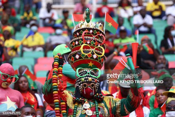 Burkina Faso football supporters are seen ahead of the opening ceremony of the Africa Cup of Nations 2021 football tournament at Stade d'Olembé in...