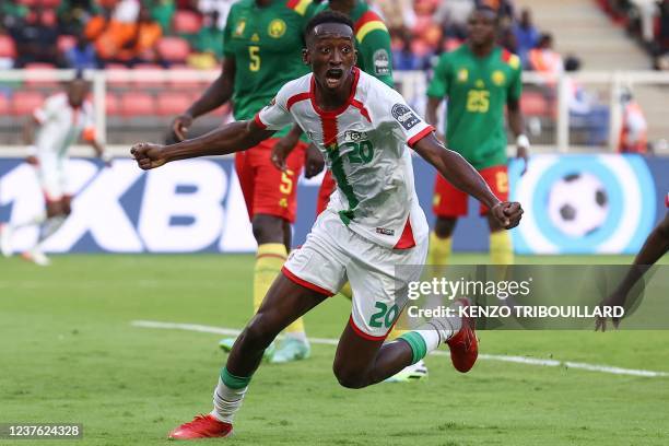 Burkina Faso's midfielder Gustavo Sangare celebrates scoring his team's first goal during the Group A Africa Cup of Nations 2021 football match...