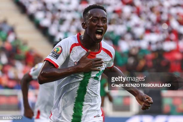 Burkina Faso's midfielder Gustavo Sangare celebrates scoring his team's first goal during the Group A Africa Cup of Nations 2021 football match...