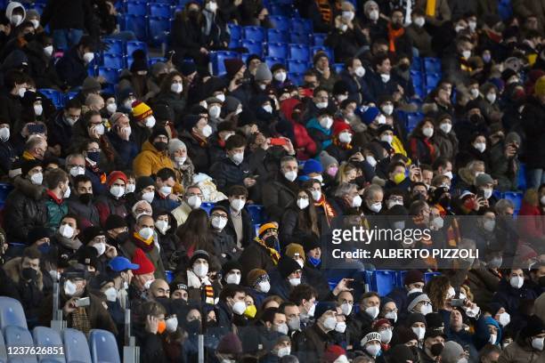 Roma's supporters wear protective masks to avoid Covid-19 spread prior to the Serie A football match between AS Roma and Juventus at the Olympic...