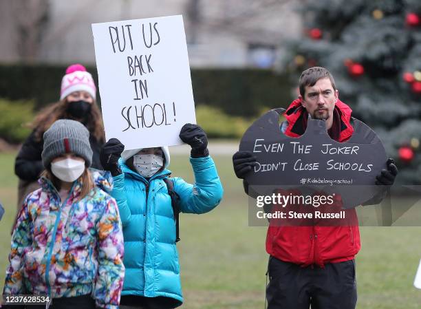 Parents and children gather on the front lawn of Queens Park to protest the governments closing of schools until January 17 as COVID-19 cases rise in...