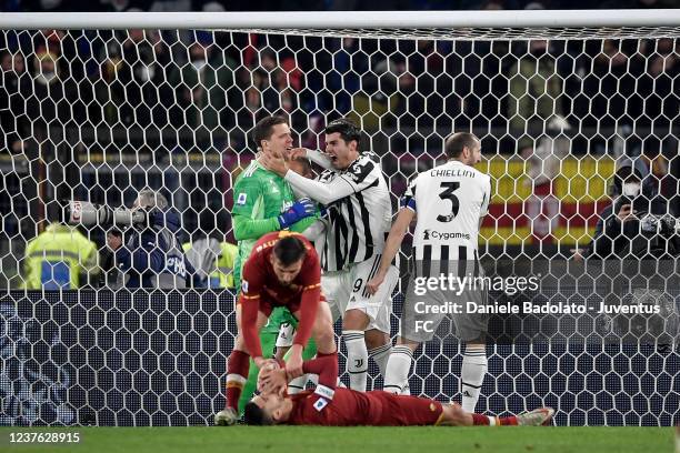 Wojciech Szczesny, Alvaro Morata, Giorgio Chiellini of Juventus celebrate the penalty save during the Serie A match between AS Roma v Juventus at...