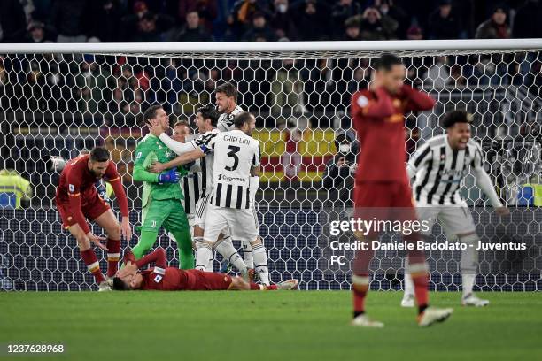 Wojciech Szczesny of Juventus celebrates the penalty save with his team mates during the Serie A match between AS Roma v Juventus at Stadio Olimpico...