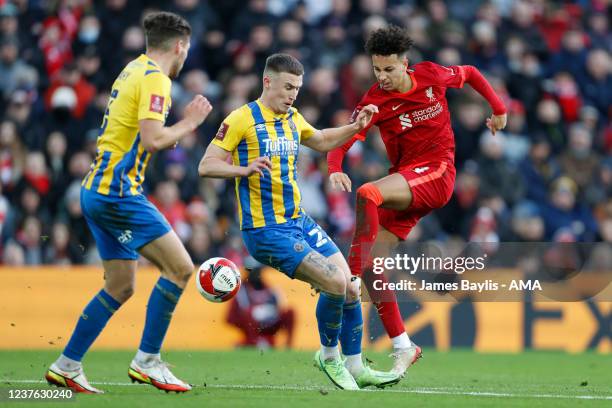 Kaide Gordon of Liverpool and George Nurse of Shrewsbury Town during the Emirates FA Cup Third Round match between Liverpool and Shrewsbury Town at...