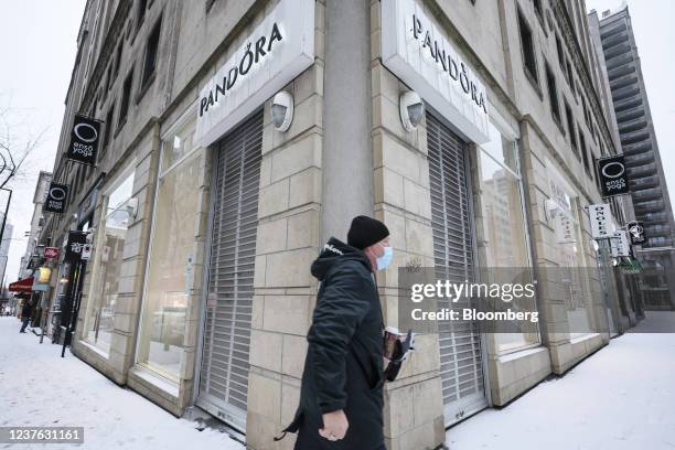 Pedestrian walks past a closed Pandora jewelry store in Montreal, Quebec, Canada, on Sunday, Jan. 9, 2022. Quebec Premier Francois Legault announced...