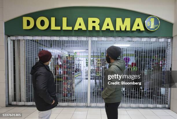 Shoppers outisde a closed Dollarama store inside a mall in Montreal, Quebec, Canada, on Sunday, Jan. 9, 2022. Quebec Premier Francois Legault...