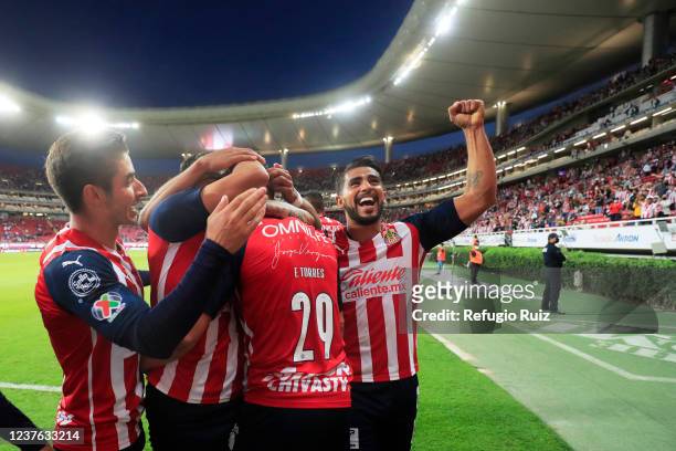 Miguel Angel Ponce of Chivas celebrates with his teammates the goal of teammate Eduardo Torres during the 1st round match between Chivas and Mazatlan...