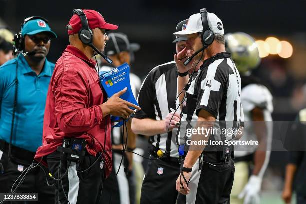 Referee Craig Wrolstad views instant replay during the NFL game between the New Orleans Saints and the Atlanta Falcons on January 9th, 2022 at...
