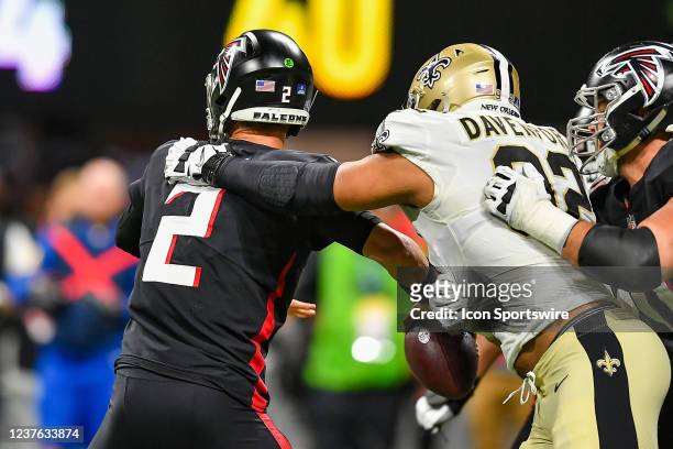 Atlanta quarterback Matt Ryan is hit by New Orleans defensive end Marcus Davenport during the NFL game between the New Orleans Saints and the Atlanta...
