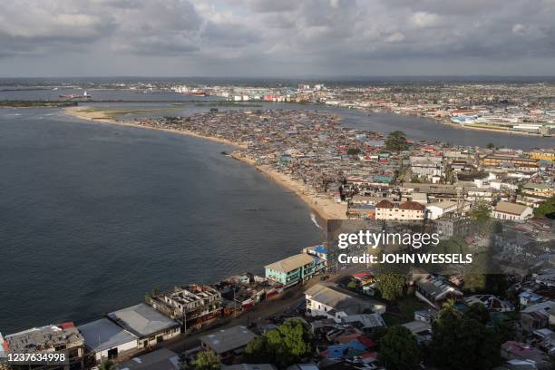 The famous West Point slum is pictured from the dilapidated Ducor hotel in Monrovia on November 18, 2021. - The Ducor Hotel, when it opened its doors...