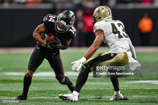 Atlanta wide receiver Russell Gage runs with the ball as New Orleans free safety Marcus Williams attempts a tackle during the NFL game between the...