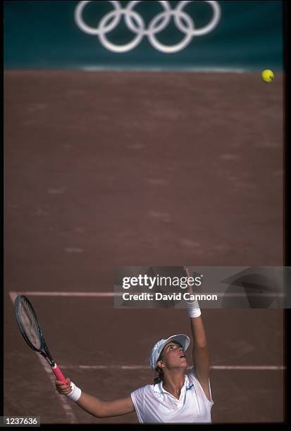 JENNIFER CAPRIATI OF THE UNITED STATES TOSSES THE BALL HIGH IN THE AIR AS SHE PREPARES TO SERVE DURING THE WOMENS SINGLES TENNIS FINAL AT THE 1992...