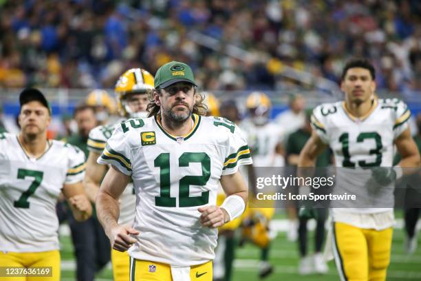 Green Bay Packers quarterback Aaron Rodgers runs off of the field heading to the locker room at the end of the first half of a regular season NFL...