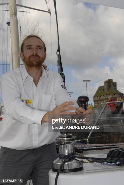 French skipper Yvon Noblet winches sails on his monohull 4O pieds Appart City, in Saint-Malo, 24 October 2006. Noblet will participate to the solo...