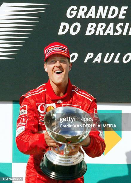 German Formula One world champion Michael Schumacher in a Ferrari celebrates his victory in the 2002 Brazilian F-1 Grand Prix 31 March 2002 in Sao...