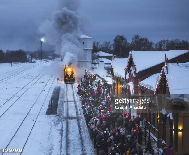 The Christmas retro train passing through the picturesque forests of the Ivanovo region arrives at the station in Shuya town of Ivanovo Oblast,...