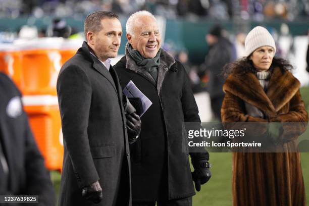 Philadelphia Eagles owner Jeffrey Lurie and general manager Howie Roseman chat with Christina Weiss Lurie during the game between the Dallas Cowboys...