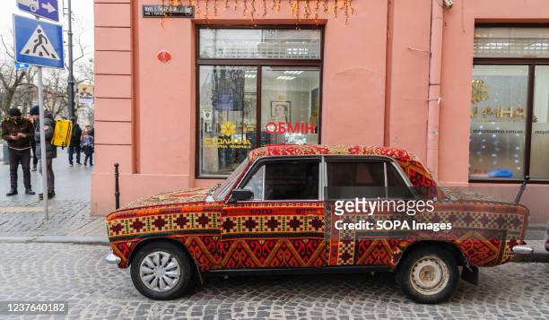 The VAZ-2101 "Zhiguli", commonly nicknamed as the "Kopeyka" automobile of the soviet era modified by covering it with carpet is seen parked on the...
